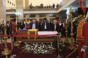 Argentina's President Cristina Fernandez (L), her Uruguayan counterpart Jose Mujica (2nd L) and her Bolivian counterpart Evo Morales (2nd R) stand next to the coffin of late Venezuelan President Hugo Chavez during a wake at the military academy in Caracas March 6, 2013. Image: Reuters
