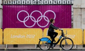 Bike blog :   a woman rides  Barclays Bank-sponsored 'Boris' bicycle during London 2012 Olympics