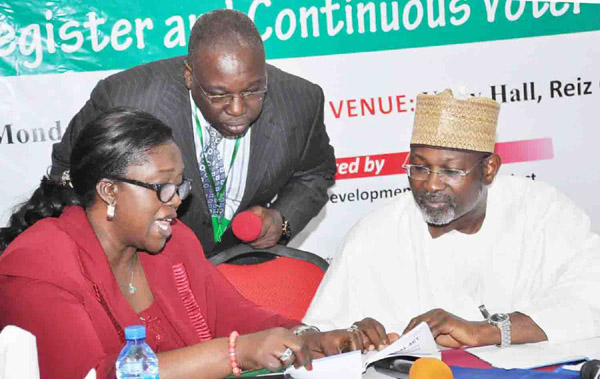 FROM LEFT: SECRETARY, INDEPENDENT NATIONAL ELECTORAL COMMISSION (INEC), MRS AUGUSTA OGAKWU; DIRECTOR, INTERNATIONAL COOPERATION AND PROTOCOL, MR OLUWOLE UZZI AND CHAIRMAN, INEC, PROF. ATTAHIRU JEGA, AT THE  EXPERIENCE-SHARING AND CONFIDENCE BUILDING CONFERENCE ON THE VOTER REGISTER AND CONTINUOUS VOTER REGISTRATION IN ABUJA