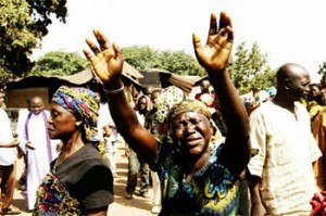 file: women mourning deaths of victims of an attack in Kaduna