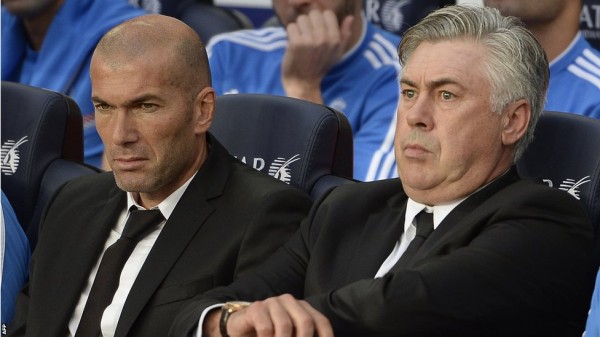 AFP Image: Carlo Ancelotti and Zinidane Zidine Watches El Clasico From the Dugout.