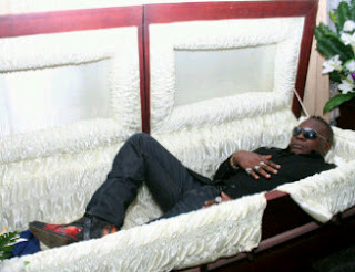 charly_boy_posing_dead_in_a_coffin