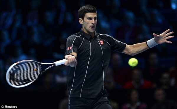 Image Credit: Reuters. Djokovic Hits Forehand on His Way to a 6-3, 6-3 Victory Over Wawrinka.