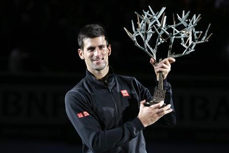 Reuters: Novak Djokovic Holds His Second Paris Masters Trophy at the Palais Omnisports de Paris, Bercy.
