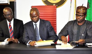 file photo: Fashola signing the Land Use Act