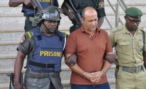 Prison officers lead Talal Ahmad Roda to Prison after he was sentenced to life imprisonment by an Abuja court 