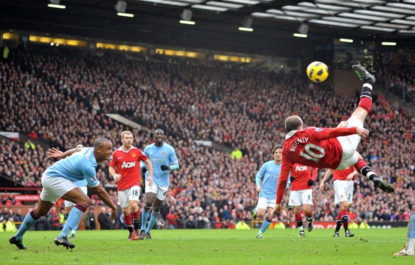 Wayne Rooney scores his United's second goal against Man City with an overhead kick in a league game.