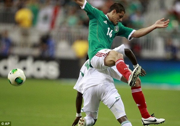 Nigeria's Ogenyi Onazi Battles for the Ball With Manchester United and Mexico Striker Javier Hernandez.