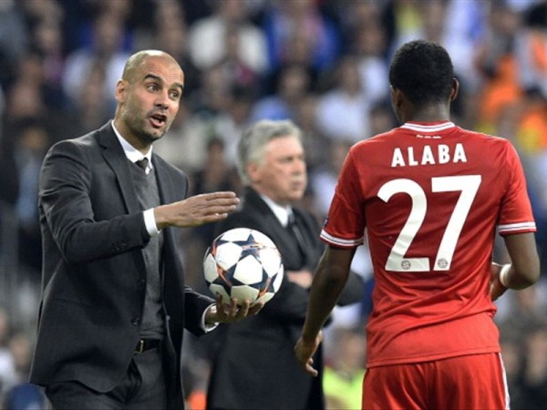 Pep Guardiola Passes Instruction to David Alaba During Wednesday Night's 1-0 Loss at Real Madrid.