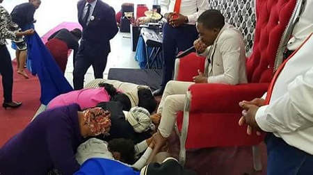 Photos: Church Members Seen Struggling To Touch And Worship 'Holy Shoes