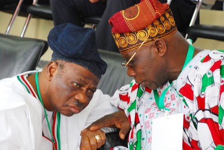 FORMER PRESIDENT OLUSEGUN OBASANJO AND FORMER PDP NATIONAL CHAIRMAN AHMADU ALI (R) CHAT DURING THE PEOPLES' DEMOCRATIC PARTY (PDP) PARTY CONVENTION IN ABUJA ON MARCH 24, 2012.  AFP PHOTO/PHILIP OJISUA (PHOTO CREDIT PHILIP OJISUA/AFP/GETTY IMAGES)