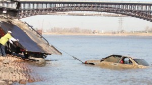 Car-plunges-into-river-after-wash