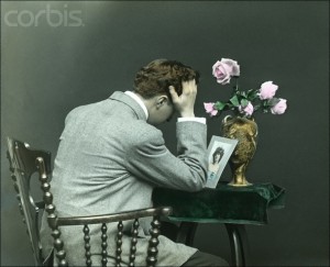 Heartbroken Man Crying Over Photograph