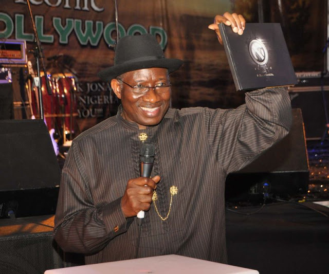 PRESIDENT GOODLUCK JONATHAN PRESENTING THE ICON OF NOLLYWOOD PHOTO BOOK AT THE EVENT