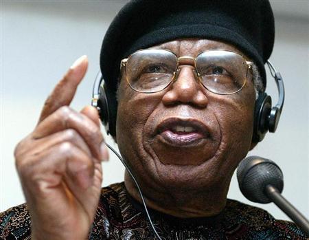 Nigerian author Chinua Achebe gestures during a news conference held during Frankfurt bookfair October 12, 2002.
