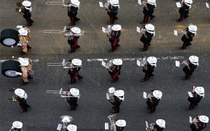 The Band of the Royal Marines plays as it follows the gun carriage along Fleet St.