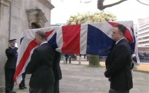 Thatcher's coffin is carried into St Clement Danes on the first part of its journey to St Paul's.