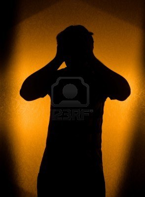 6835824-depression-and-pain--silhouette-of-man-in-the-darkness[1]