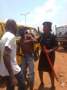 file: bus conductor and agbero fighting over illegal dues collection as police officer tries to quell the fight