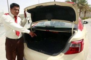 Abdul Halim pointing to the boot of his cab where he found the bag containing cash and diamonds