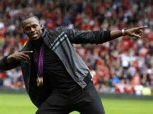 Bolt Pose With His Three Gold Medals at Old Trafford After the London Olympics.