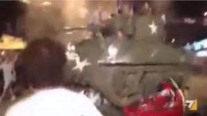 Image from a video showing a tank driven by Atalanta fans that drove over two cars decorated in the colours of rival teams Brescia and Roma. 