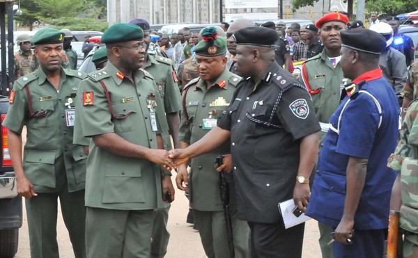 CHIEF OF ARMY STAFF, LT.-GEN AZUBUIKE IHEJIRIKA, BEING RECEIVED BY THE POLICE & NSCDC OFFICIAL AT THE SCENE OF A BLAST THAT ROCKED UN HOUSE IN ABUJA IN 2011