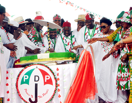 PRESIDENT GOODLUCK JONATHAN (5TH R); FIRST LADY, DAME PATIENCE JONATHAN (4TH R); VICE PRESIDENT NAMADI SAMBO (8TH R); PDP NATIONAL CHAIRMAN, ALHAJI BAMANGA TUKUR (7TH R) AND OTHERS CUTTING THE CAKE AT THE PDP SPECIAL NATIONAL CONVENTION IN ABUJA ON SATURDAY