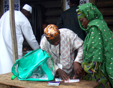 AN ELDERLY WOMEN BEING ASSISTED BY AN AGENT TO VOTE  DURING THE RE-RUN OF LOCAL GOVERNMENT ELECTION IN OFFA, KWARA,  ON SATURDAY
