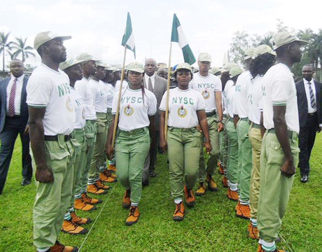 GOV. CHIBUIKE AMAECHI OF RIVERS INSPECTING A GUARD OF HONOUR AT THE PASSING OUT CEREMONY OF NYSC BATCH 'C' CORPS MEMBERS IN PORT HARCOURT ON THURSDAY