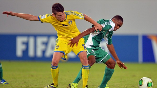Getty Image: Golden Eaglets Player Vies for the Ball With a Swede. 