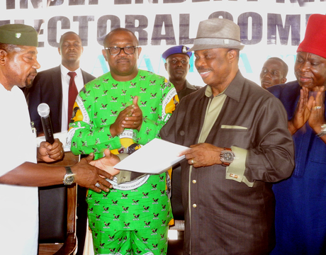 FEDERAL COMMISSIONER OF INEC IN CHARGE OF ANAMBRA, ABIA AND BENUE, CHIEF LAWRENCE NWURUKU (L), PRESENTING CERTIFICATE OF RETURN TO ANAMBRA GOVERNOR-ELECT, CHIEF WILLIE OBIANO (2ND-R), IN AWKA ON MONDAY (2/12/13). WITH THEM ARE GOV. PETER OBI (2ND-L) AND THE NATIONAL CHAIRMAN OF APGA, CHIEF VICTOR UMEH (R).