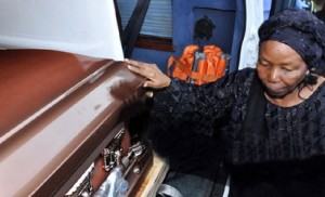  Widow of Solomon Lar, Mary, blessing her husband’s remains at the airport reception in honour of Late Solomon Lar in Abuja on Friday Solomon Lar's widow, Mary, by her husband’s remains at the Abuja airport 