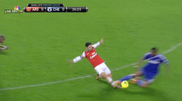 Image: NBC Live. Mikel Catches Arteta's Shin After Missing the Ball.