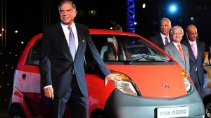 Tata group tycoon Ratan Tata posing with a nano in 2009