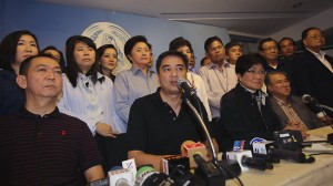 Democrat leader Abhisit Vejjajiva, center, with party members