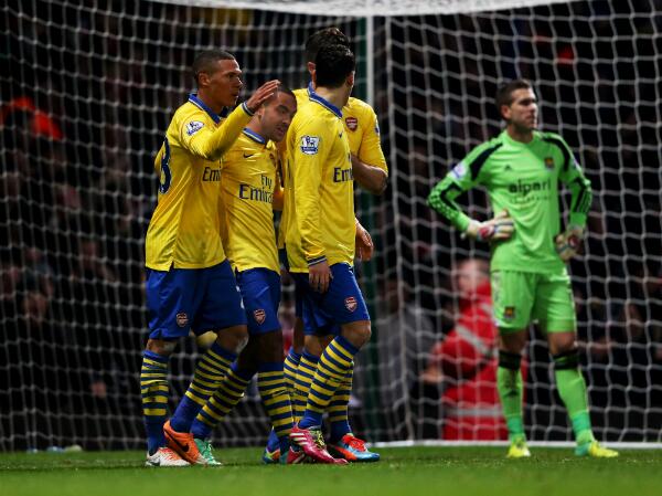 Theo Walcott celebrates His Second Goal with Teammates. Getty Images.