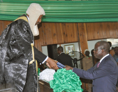 GOV. ADAMS OSHIOMHOLE OF EDO (R), PRESENTING THE 2014 BUDGET ESTIMATES TO THE SPEAKER OF THE STATE HOUSE OF ASSEMBLY, MR UYI IGBE IN BENIN 