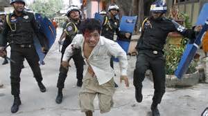 Cambodia police beat protester