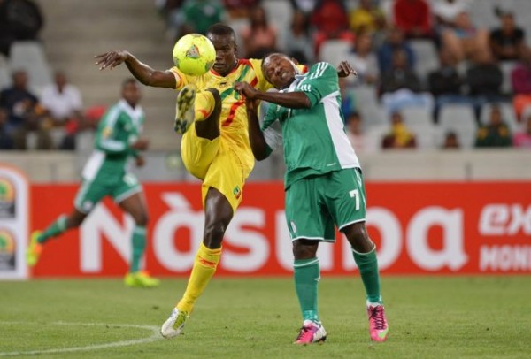 Chrisantus Ejike Uzoenyi Challenges for the Ball During the Opening Day Loss to Mali.