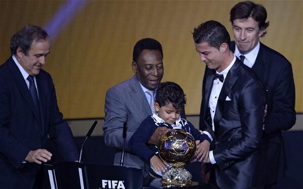 Cristiano Ronaldo (Sr and Jr) Receives the 2013 Ballon d'Or Award from Michael Platini and Pele.