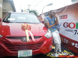 Sean-Tizzle-poses-with-his-new-car-copy
