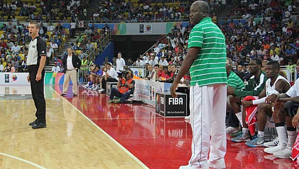 Coach Ayo Bakare Watches D'Tigers' Match from the Touchline.