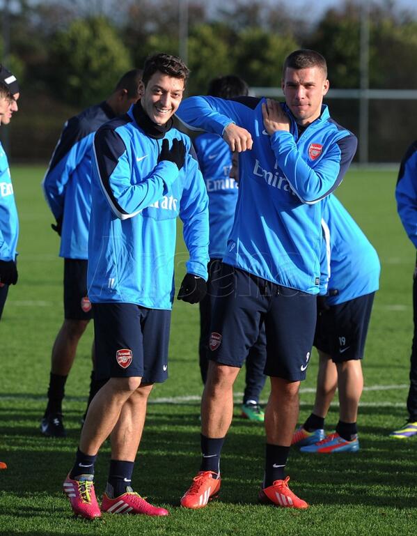 Mesut Ozil and Lukas Podolski During Arsenal Training.