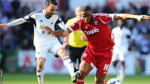 Swansea's Leon Britton Challenges Victor Anichebe in a League Match Last Weekend.