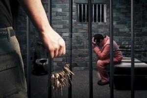 11589127-prison-guard-with-keys-outside-dark-prison-cell