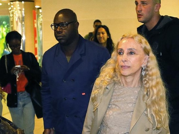 12 Years a Slave director Steve McQueen, left, and editor-in-chief of Vogue Italia Franca Sozzani, right, arrive in Florence for the Kimye wedding. Photo: AP 