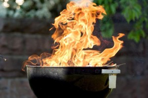 Raging-fire-from-charcoal-barbecue-grill