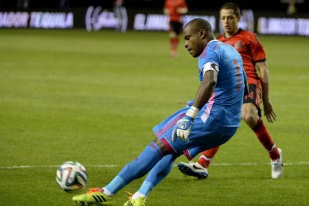 Vincent Enyeama Fends Off Javier Hernandez's Threat During Nigeria-Mexico Friendly Match.