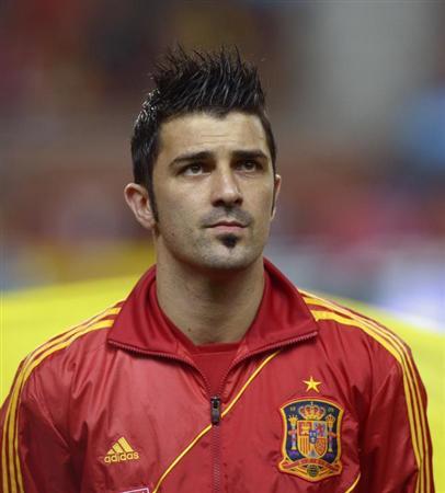David Villa Honours the Spanish National Anthem Before A 2014 WOrld Cup Qualifying Match Against Finland in March 2013. REUTERS/Vincent West